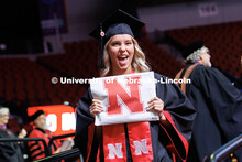 Ashley Ocken celebrates after receiving her Bachelor of Fine Arts degree. Winter undergraduate comme
