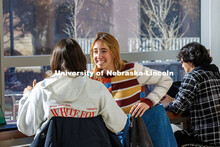 Lauren Winn, a freshman Psychology major, chats with her friend, Taylor Schramm (left) in the Colleg