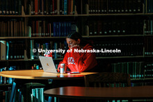 A student works on her laptop in Love Library North on the first day classes for Spring Semester 202
