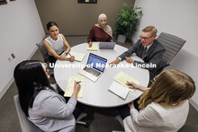 Professor Kevin Ruser meets with law students in the Immigration Clinic. College of Law Clinics. Sep