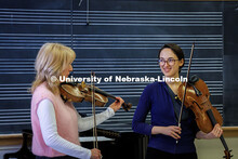 Fiona Bonds of the Academy of St. Martin in the Fields Orchestra instructs Andrea Alvarado Troncoso,