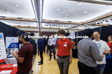 Daniel Koland, a senior Economics major, walks through a busy section at Friday’s Career Fair. Uni