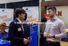 Jaxson Weber, a junior Finance major, chats with Kyle Swinicki of Applied Underwriters. University C