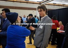 Mac DePriest, a senior Mathematics and Computer Science major, chats with a representative from Comp