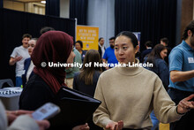A student has a conversation with a representative during Friday’s Career Fair. University Career 