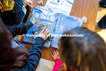 Lincoln High School students look through a VEX Robotics kit during the TRIO Vex Robotics class afte