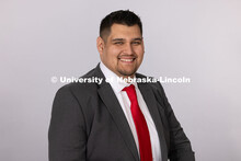Studio portrait of Miguel Hernandez, Transfer Recruitment Coordinator for the Office of Admissions. 
