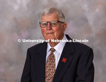 Studio portrait of Doyle Wolverton, Professor Emeritus of the UNL Department of Animal Science. He i
