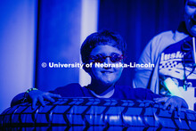 Zalyn, a miracle child, stands in a stack of blow-up tires during the Huskerthon rave. Huskerthon 20