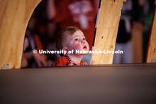 A child watches the stage at the 2025 Huskerthon event. Huskerthon 2025, also known as Dance Maratho