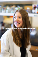 University of Nebraska–Lincoln undergraduate Vanessa Hubing, poses in lab coat for a photo in Luwe