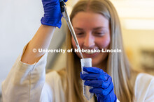 Avery Marquis, Senior Spanish, Biological Sciences and Pre-Veterinary Medicine major, works with tes