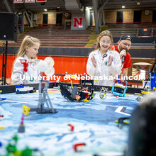 The “Mad Scientists” group watches their robot during the practice robot match at the 4-H Roboti