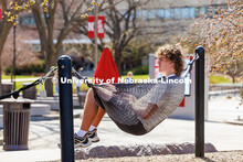 Freshman, Matt Fischer sits on a hammock outside the Nebraska Union on the Monday post Spring Break.