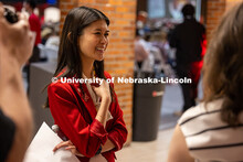 Christine Trinh, a 2023 alumna, talks with UNL staff and served as the keynote speaker during an Adm