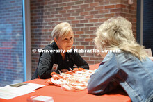 Nicole Sweigard helps visitors at the Alumni table in the Visitor’s Center. Admitted Students Day.