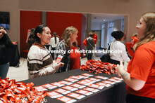 Students help Triana Boerke from Bellevue sign in at the Visitor Center. Admitted Students Day. Admi