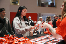 Students help Yuen from Omaha sign in at the Visitor Center. Admitted Students Day. Admitted Student