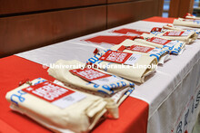 Table full of swag (bags and name tags) for the students awarded the Presidential Scholarship for th