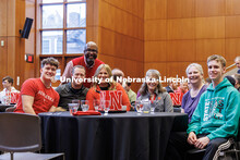 Chancellor Rodney Bennett poses with a group of parents and students at the Presidential Scholars br