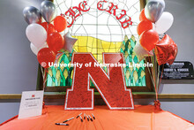 Admitted Students sign their name on a large "N" poster during Admitted Student Day. The event featu