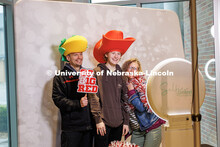 An Admitted Student and parents pose for a photo at the free photo booth in the Nebraska Union’s C