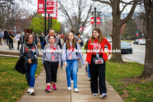 Claire Colbet (middle left), Sarah Lange, and Ashlee Anderson (right) walk to the Coliseum after the