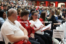 Patrick from Bellevue looks over the agenda in a full Coliseum on Admitted Student Day. Admitted Stu