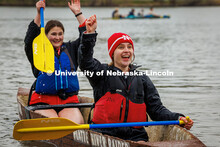 (Front to back) Lauren Flickinger and Chloe Mann, both senior civil engineering majors, cheer as the