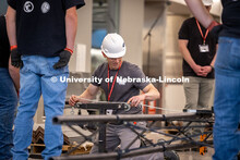 Craig Cogan, a judge for the ASCE Steel Bridge Competition, evaluates the UNL team’s bridge in Kie