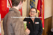 Courtney Santos, director of undergraduate research and fellowships, congratulates Luke McDermott, a