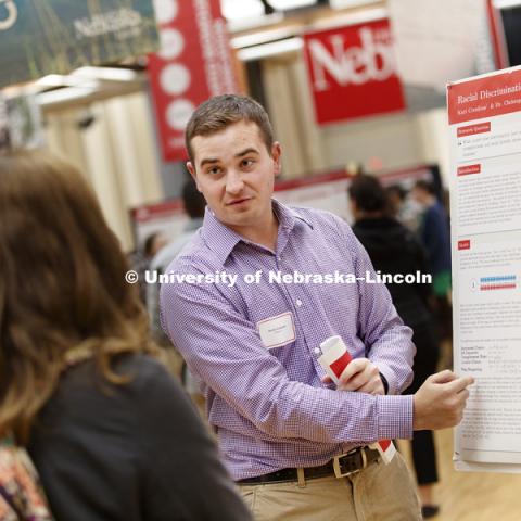 Kurt Cronican discusses his research on racial discrimination in labor markets at the first day of the Spring Research Fair features undergraduate student research. April 4, 2017. Photo by Craig Chandler / University Communication.