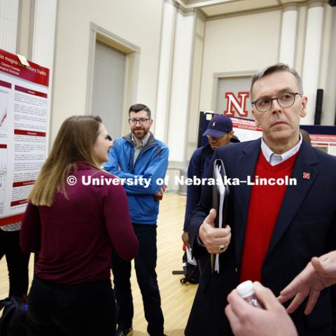 Chancellor Ronnie Green listens to a student's research at the Research Fair on Tuesday afternoon. The first day of the Spring Research Fair features undergraduate student research. April 4, 2017. Photo by Craig Chandler / University Communication.