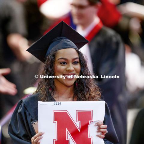 Kiara Moody shows off her College Business diploma for a photo. Students received their undergraduate diplomas Saturday morning in Lincoln's Pinnacle Bank Arena. 2452 degrees were awarded Saturday morning. May 6, 2017. Photo by Craig Chandler / University