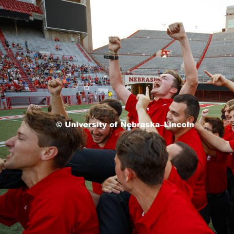 Kyle Webber, a baritone player from Omaha, is carried off by band members after he won the annual marching competition during the Cornhusker Marching Band's exhibition performance at Memorial Stadium.  August 18, 2017. Photo by Craig Chandler / University
