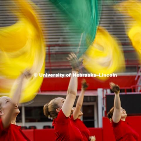 Flags swirl as Brooke Harmon and the rest of flag line perform during The Cornhusker Marching Band's annual exhibition performance at Memorial Stadium. August 18, 2017. Photo by Craig Chandler / University Communication.