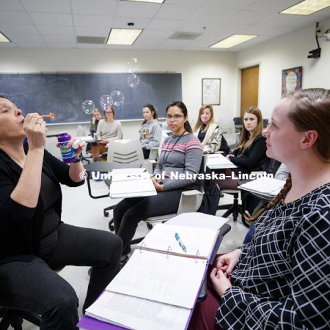 Cynthia Cress uses bubbles to teach students how to communicate with children in her SLPA 862A - Language Disorders in Special Populations - Birth to Three: Communication Assessment and Intervention course. February 15, 2019. Photo by Craig Chandler /