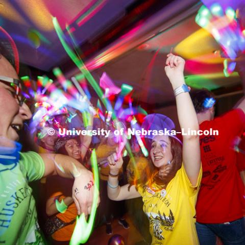 Joe Sherman and Taylor Rambo dance in the middle of a light show Saturday night. 1274 Nebraska students signed up to be part of the Huskerthon Dance Marathon for Children's Hospital in Omaha. February 17, 2019. Photo by Craig Chandler / University