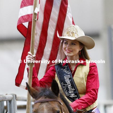 Miss Rodeo University of Nebraska-Lincoln Shelby Riggs brings in the American flag to begin the rodeo. 60th anniversary of the University of Nebraska-Lincoln Rodeo Club. April 20, 2018. Photo by Craig Chandler / University Communication.