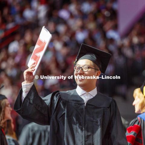 Tian Gao celebrates his College of Business degree. Undergraduate Commencement at Pinnacle Bank Arena. May 5, 2018. Photo by Craig Chandler / University Communication.