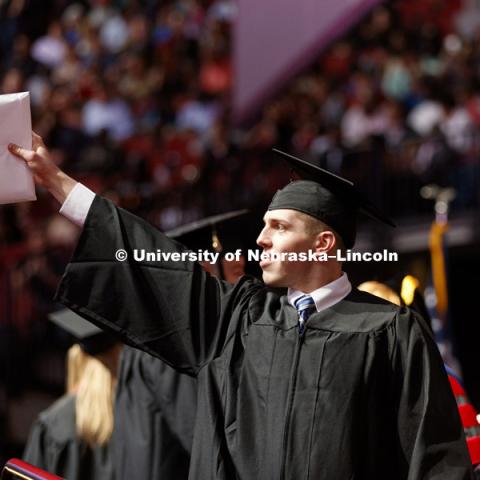 Nicholas Theisen celebrates his College of Business degree. Undergraduate Commencement at Pinnacle Bank Arena. May 5, 2018. Photo by Craig Chandler / University Communication.