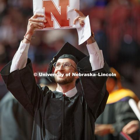 Cameron Holmes celebrates his Arts and Sciences degree. Undergraduate Commencement at Pinnacle Bank Arena. May 5, 2018. Photo by Craig Chandler / University Communication.