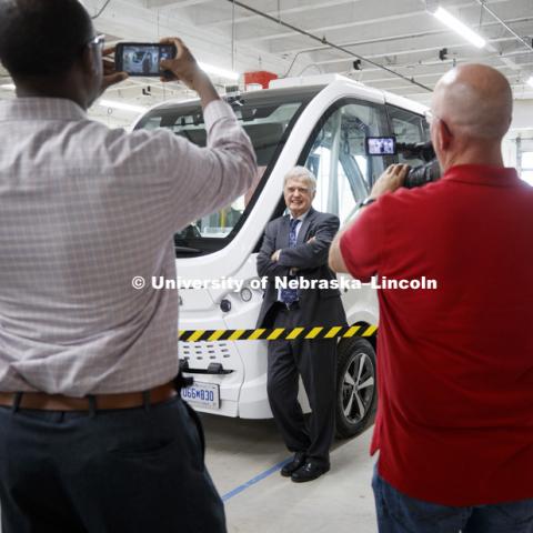 Lincoln Mayor Chris Beutler poses for photos following the press conference. The automated electric Navya (NAHV-yah) shuttle is displayed at Nebraska Innovation Campus. June 20, 2018. Photo by Craig Chandler / University Communication.