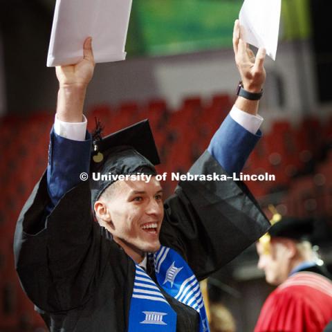 Daniel Leal celebrates the glory of his graduation and College of Business diploma. Summer Commencement at Pinnacle Bank Arena. August 11, 2018. Photo by Craig Chandler / University Communication.