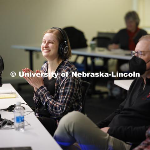 Rachael Wagner, a Husker doctoral student, applauds the surgical robot cuts on the International Space Station. Nebraska Engineering professor and Virtual Incision founder Shane Farritor successfully performed robotic surgery on the International Space Station. Controlled from the Virtual Incision offices in Lincoln, NE, surgeons cut rubber bands–mimicking surgery–inside a payload box on the International Space Station. February 10, 2024. Photo by Craig Chandler / University Communication and Marketing.