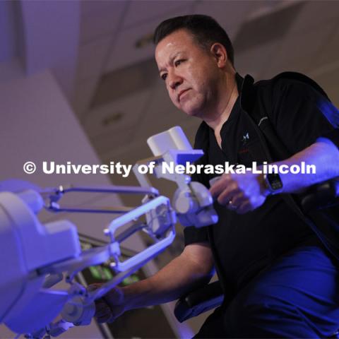 Dr. Michael Jobst, a colorectal surgery specialist in Lincoln, NE, concentrates making the first surgical robotic cuts on the International Space Station. Controlled from the Virtual Incision offices in Lincoln, NE, surgeons cut rubber bands–mimicking surgery–inside a payload box on the International Space Station. February 10, 2024. Photo by Craig Chandler / University Communication and Marketing.