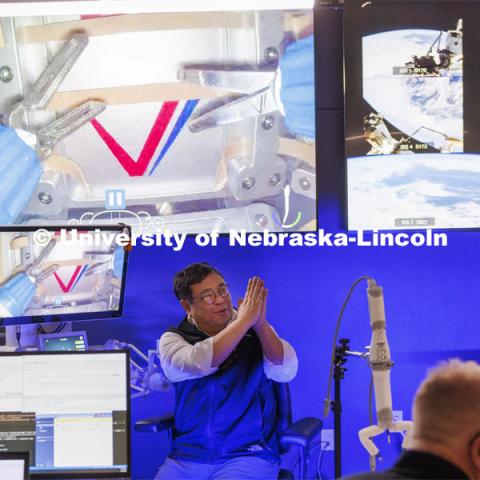 Yuman Fong, chair of surgery at the City of Hope Cancer Centers, thanks the crowd after successfully making a cut using the Space MIRA. Shane Farritor successfully performed robotic surgery on the International Space Station. Controlled from the Virtual Incision offices in Lincoln, NE, surgeons cut rubber bands–mimicking surgery–inside a payload box on the International Space Station. February 10, 2024. Photo by Craig Chandler / University Communication and Marketing.