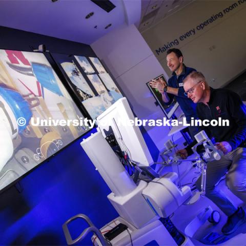 Nebraska Engineering professor and Virtual Incision founder Shane Farritor takes a turn using the surgical robot as Dr. Dmitry Oleynikov applauds a successful cut. Virtual Incision successfully performed robotic surgery on the International Space Station. Controlled from the Virtual Incision offices in Lincoln, NE, surgeons cut rubber bands–mimicking surgery–inside a payload box on the International Space Station. February 10, 2024. Photo by Craig Chandler / University Communication and Marketing.