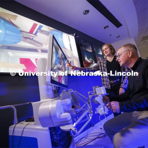 Nebraska Engineering professor and Virtual Incision founder Shane Farritor successfully performed robotic surgery on the International Space Station as Rachael Wagner, a Husker doctoral student, looks on. Controlled from the Virtual Incision offices in Lincoln, NE, surgeons cut rubber bands–mimicking surgery–inside a payload box on the International Space Station. February 10, 2024. Photo by Craig Chandler / University Communication and Marketing.