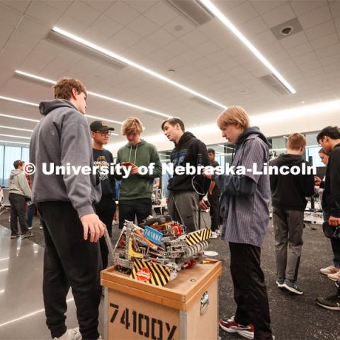 Concordia Junior/Senior High School Robotics team, run by Matthew Mueller, preparing their bot before a match. 2024 VEX Robotics Outreach Tournament hosted in Kiewit Hall. February 10, 2024. Photo by Taryn Hamill for University Communication and Marketing.